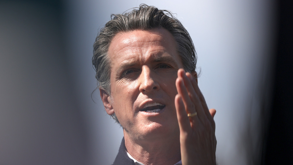 Gavin Newsom waving his hand