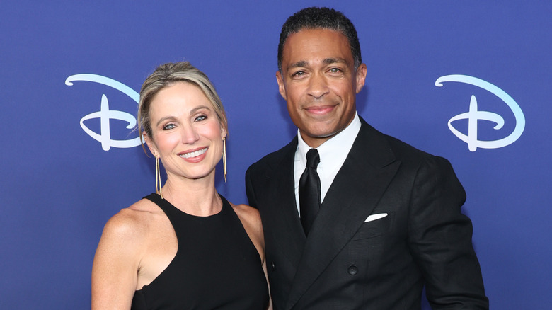 Amy Robach and T.J. Holmes both smiling