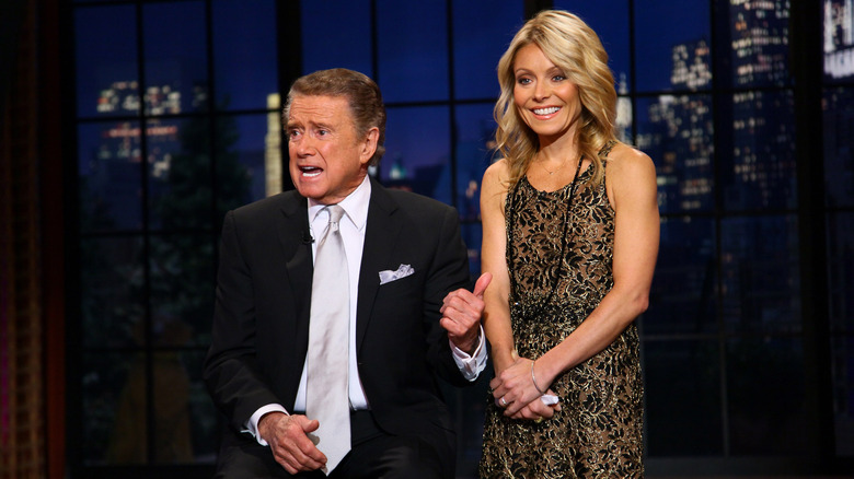 Regis Philbin and Kelly Ripa on stage, speaking