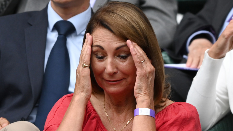 Carole Middleton holding her face