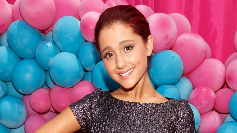 Ariana Grande in front of balloons