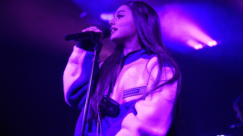 Ariana Grande performing in pink light