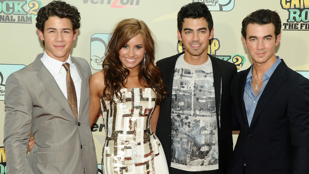 Demi Lovato and the Jonas Brothers smile