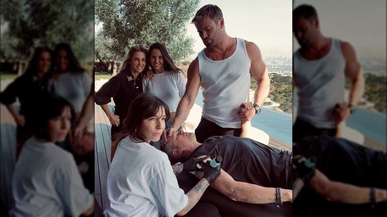 Chris Hemsworth, Elsa Pataky, and Luciana Barroso look as Matt Damon gets tattooed