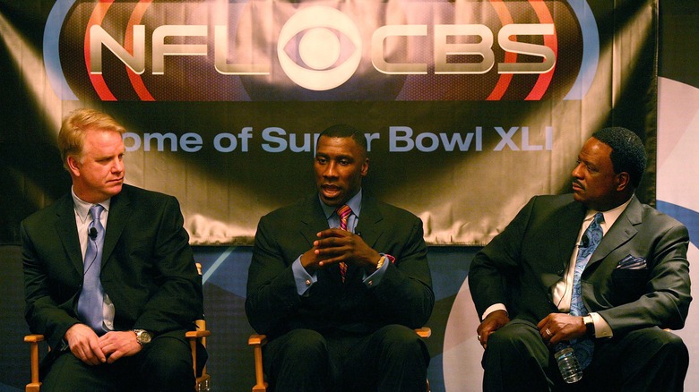 Shannon Sharpe flanked by fellow CBS analysts Boomer Isiason and James Brown