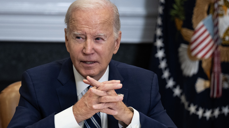 Joe Biden sitting at a desk