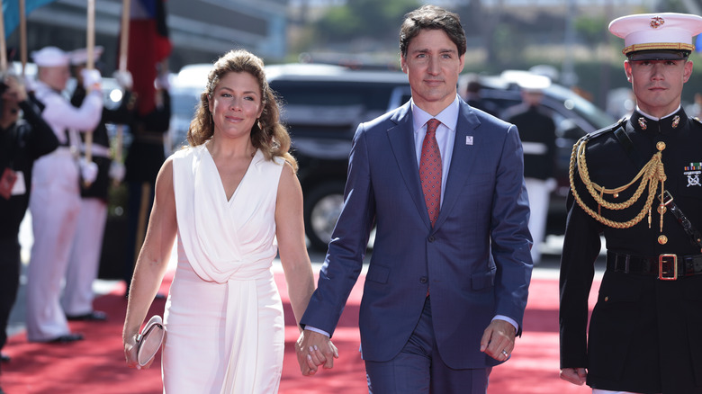 Sophie Gregoire and Justin Trudeau hold hands