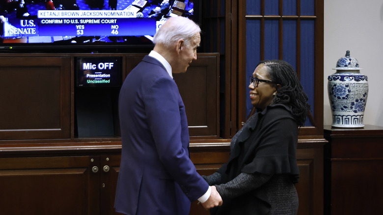 Joe Biden, Judge Ketanji Brown Jackson grasping hands