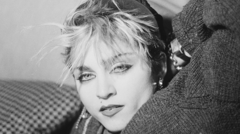 Madonna posing with spiky bangs