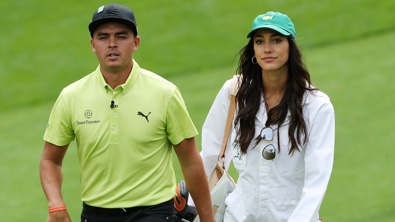 Rickie Fowler and Allison Stokke walking