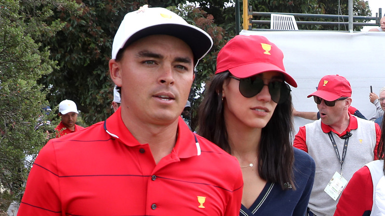 Rickie Fowler and Allison Stokke walking