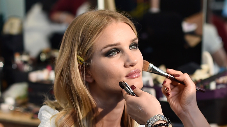 Rosie Huntington-Whiteley in a makeup chair