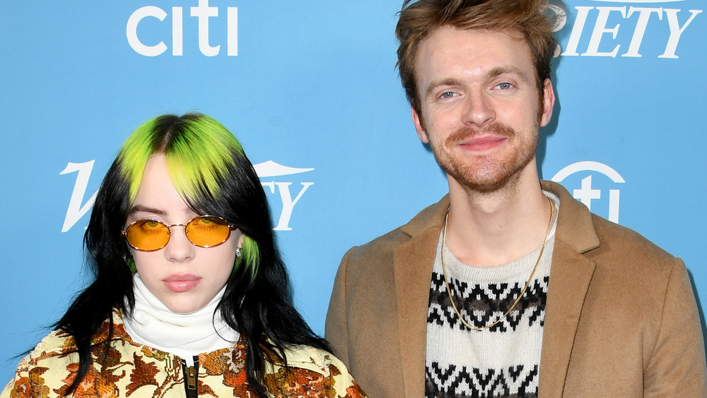 Billie Eilish and Finneas O'Connell smiling