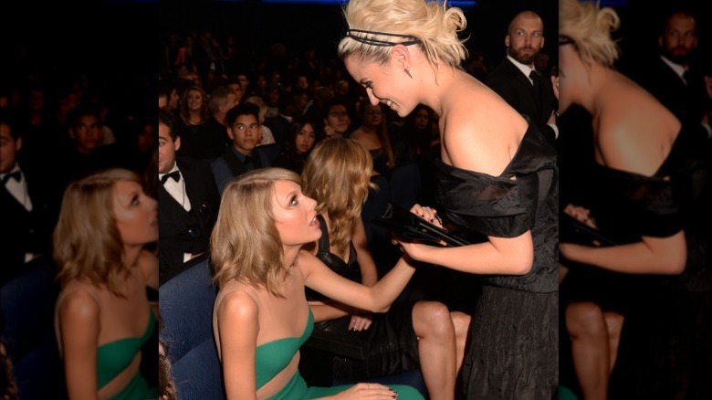 Taylor Swift touching Dianna Agron 