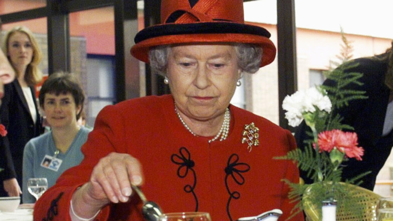 Queen Elizabeth II drinks tea