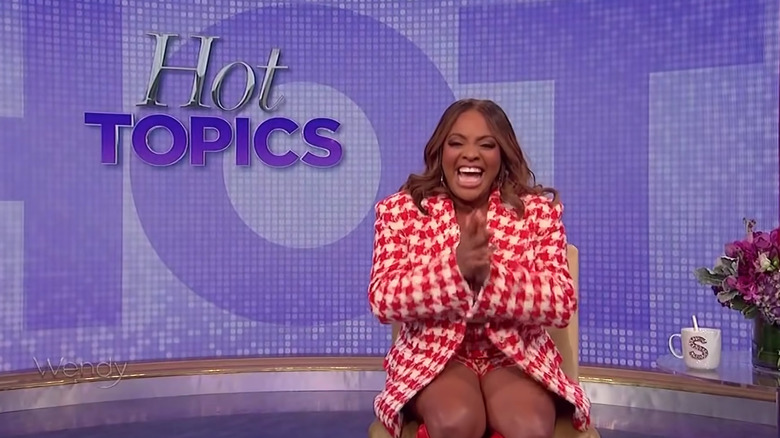 Sherri Shepherd clapping and smiling in excitement
