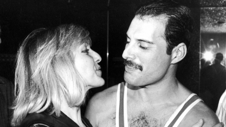 Mary Austin and Freddie Mercury looking at each other