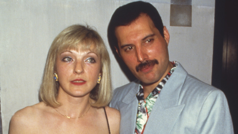Freddie Mercury and Mary Austin posing for cameras