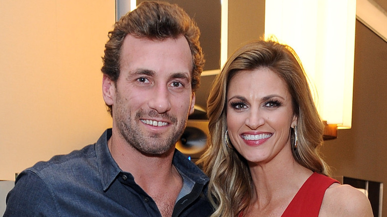 Erin Andrews and Jarret Stoll smiling and posing indoors