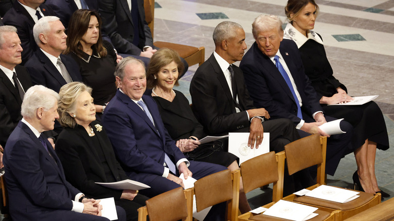 Al Gore, Mike Pence, Karen Pence, Bill Clinton, Hillary Clinton, George W. Bush, Laura Bush, Barack Obama, Donald Trump, and Melania Trump attending the state funeral for former U.S. President Jimmy Carter