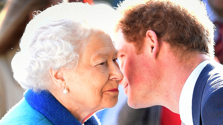 Queen Elizabeth and Prince Harry embrace