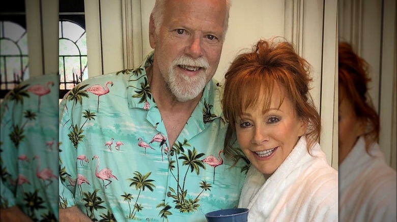 Rex Linn and Reba McEntire smiling