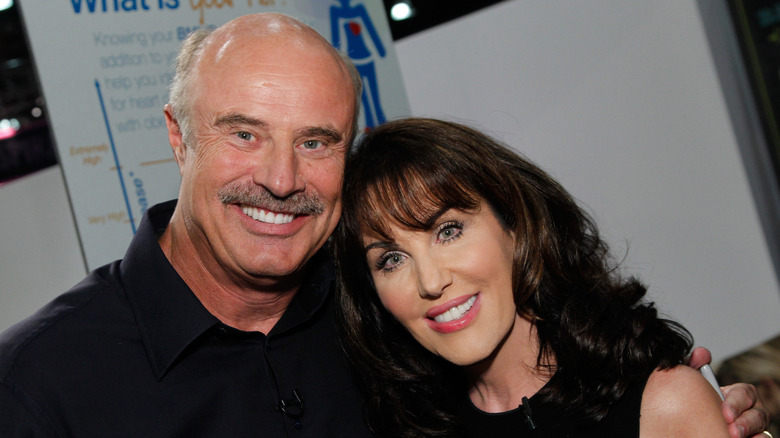 Phil McGraw and Robin McGraw embracing