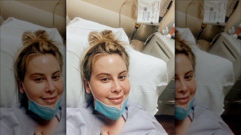 Tara Lipinski lies in a hospital bed