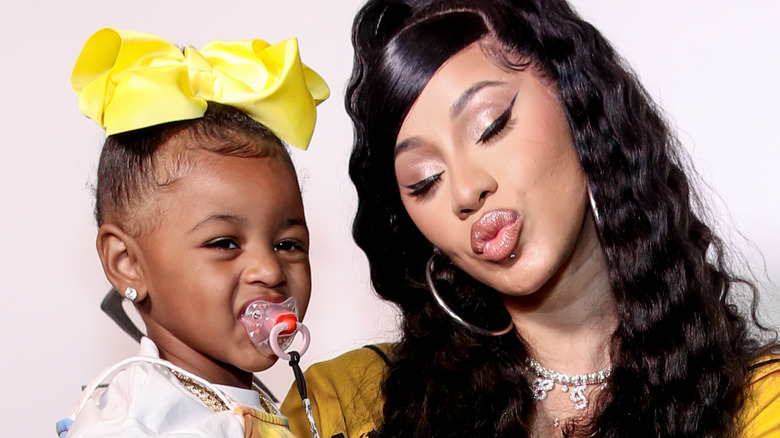 Cardi B holds her daughter Kulture on the red carpet