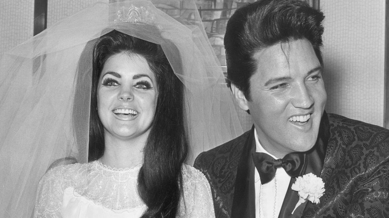 Priscilla Presley and Elvis Presley laughing