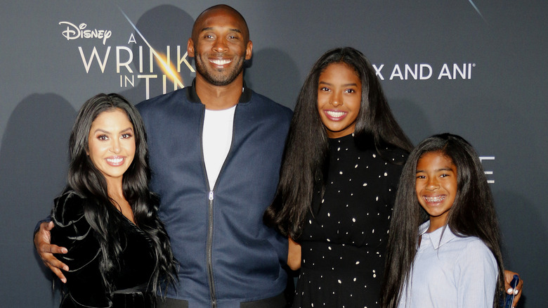 Vanessa Kobe Bryant smiling with their daughters