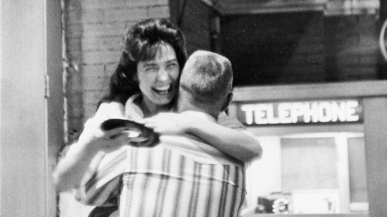 Loretta Lynn hugging a man