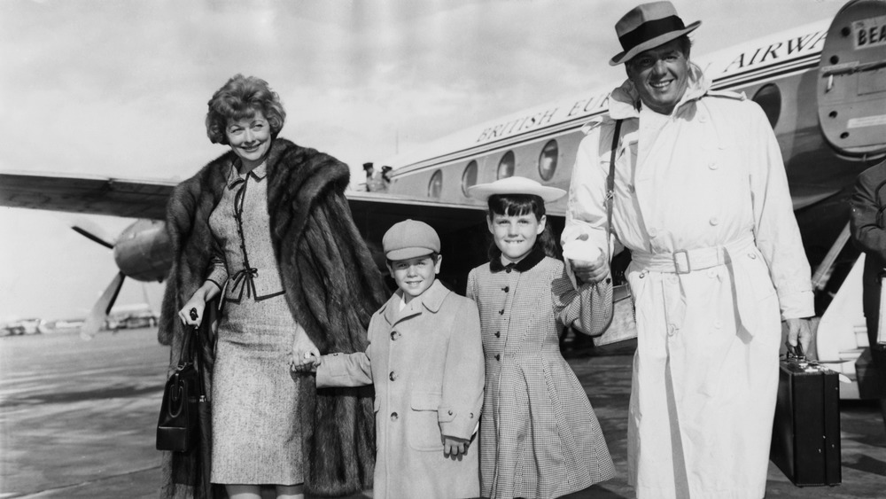 Lucille Ball, Desi Arnaz Jr., Lucie Arnaz, and Desi Arnaz holding hands