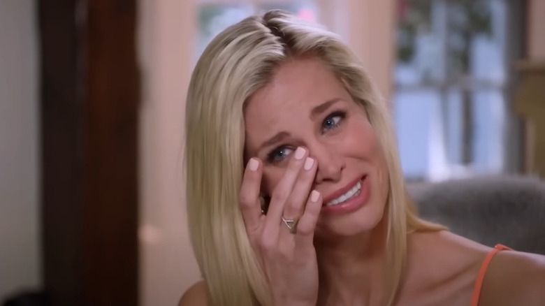 Brooke Burns wiping tears from eyes