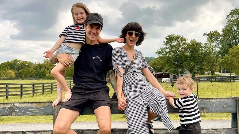 Shenae Grimes, Josh Beech, and children Bowie and Kingsley smiling