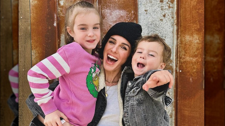 Shenae Grimes-Beech holding Bowie and Kingsley Beech