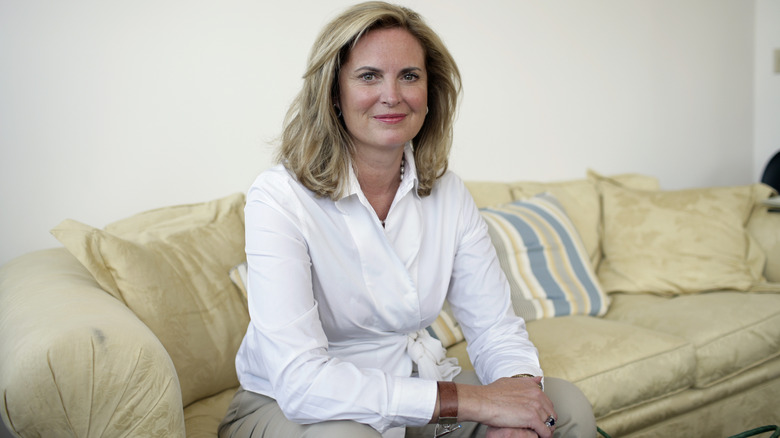 Ann Romney sits on a couch