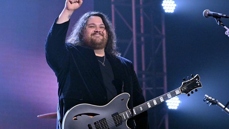 Wolfgang Van Halen holding a guitar