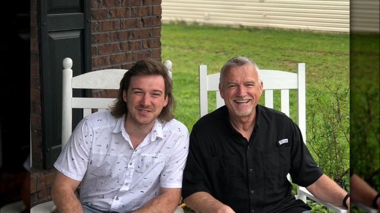 Morgan Wallen and his dad posing for a photo