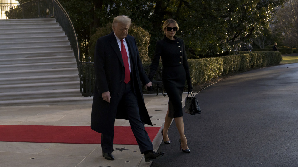 Melania and Donald Trump walking 