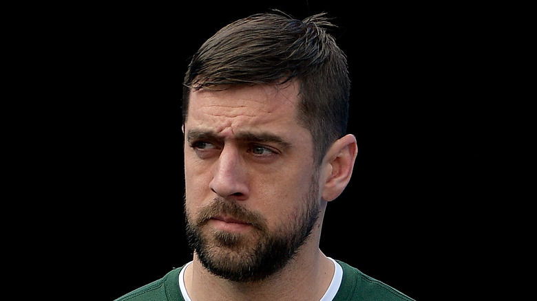 Aaron Rodgers in green shirt