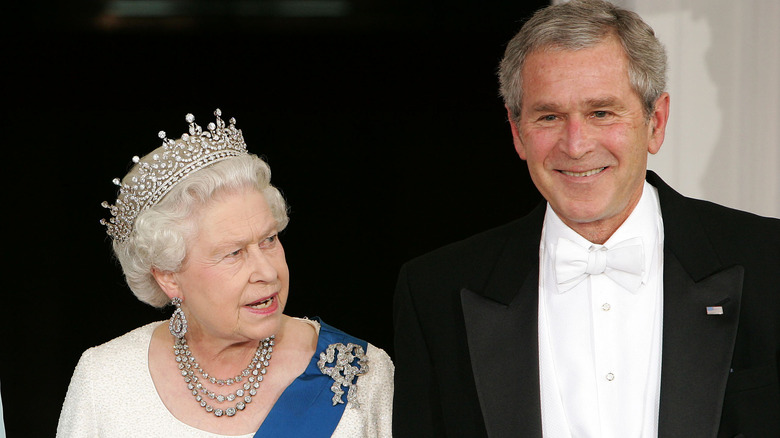 Queen Elizabeth talking to George. W. Bush