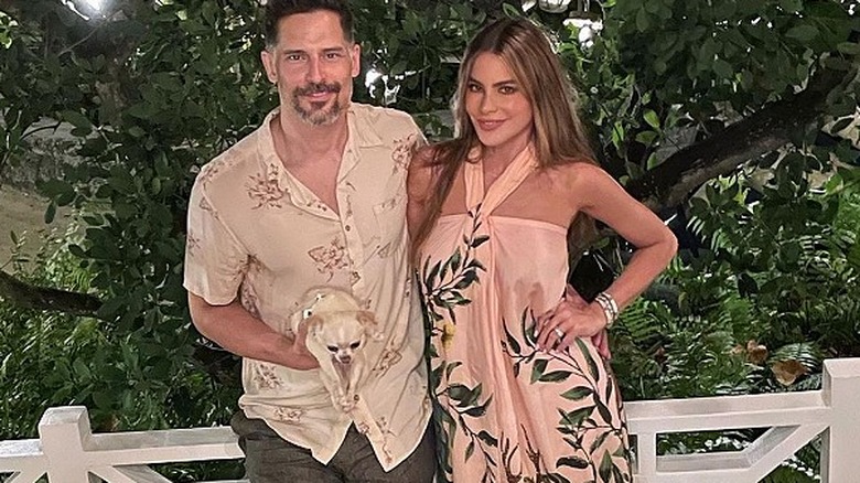 Joe Manganiello holding dog Bubbles and Sofia Vergara