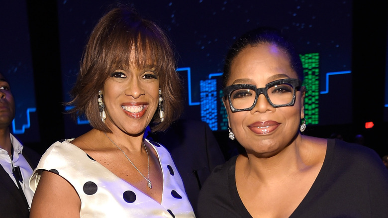 Gayle King and Oprah Winfrey smiling