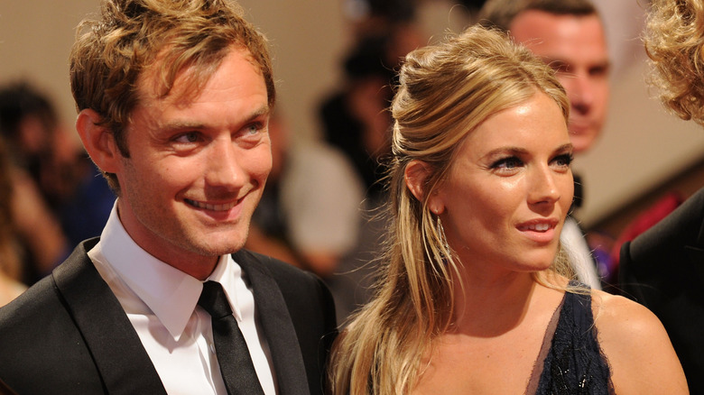 Sienna Miller and Jude Law smiling 