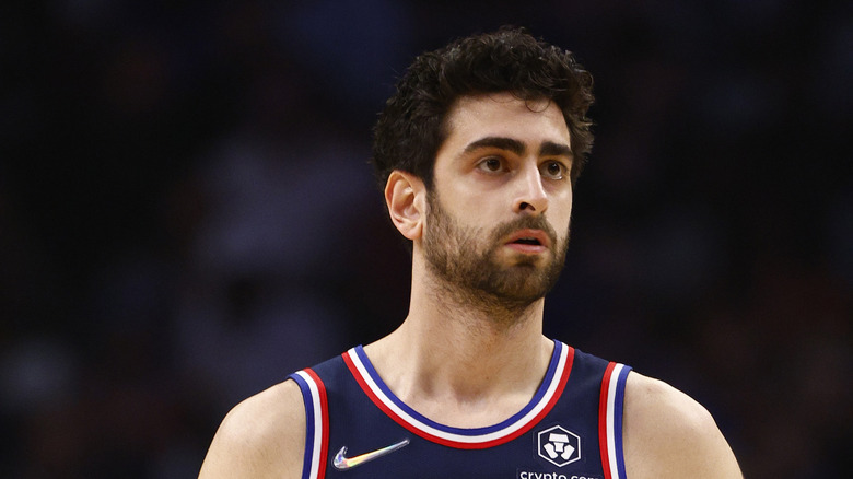 Furkan Korkmaz in uniform, looking away