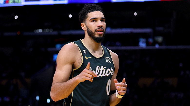 Jayson Tatum pointing at the camera in uniform