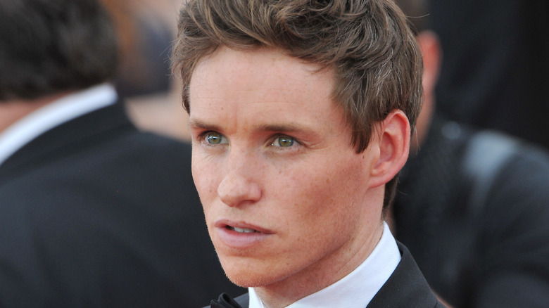 Eddie Redmayne looking toward distance