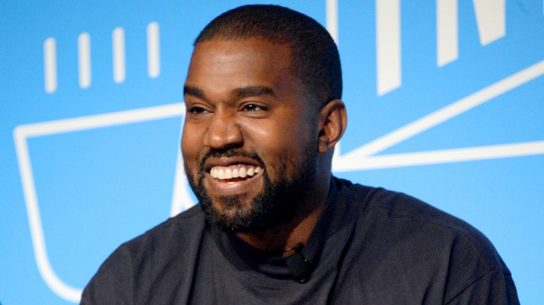 Kanye West speaks on stage at the "Kanye West and Steven Smith in Conversation with Mark Wilson"