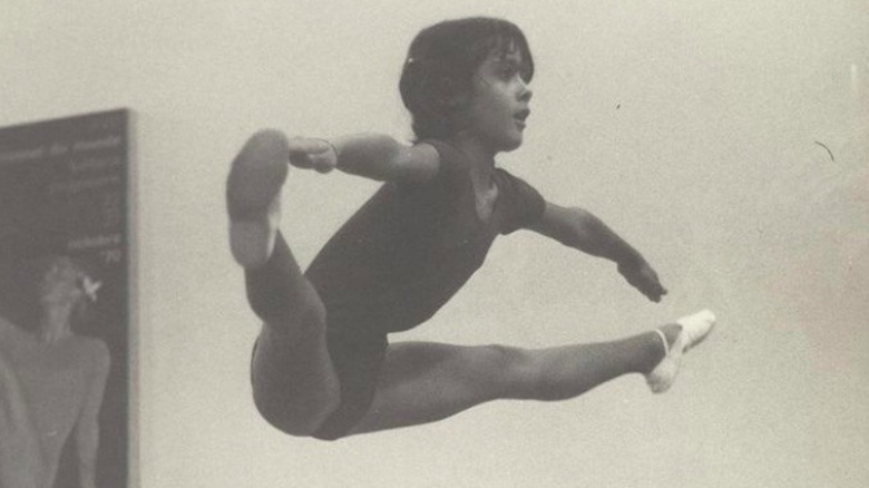 Young Salma Hayek practicing gymnastics